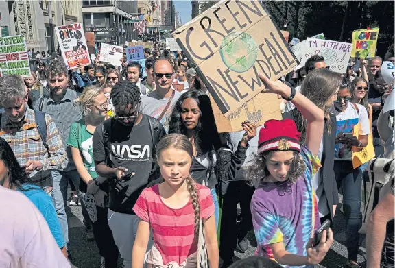  ?? Picture: Getty. ?? Swedish climate activist Greta Thunberg, centre, has done much to highlight the extent of the emergency facing humanity.