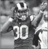  ?? Billy Hurst Associated Press ?? RAMS ROOKIE Todd Gurley rushed for 133 yards, his fourth 100-yard game in four NFL starts.