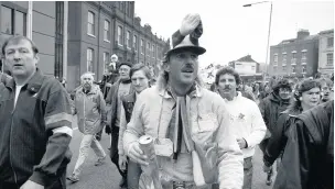  ??  ?? Ian Botham walking through the centre of Gloucester, November 20 1985 on one of his first charity walks