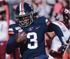  ?? STEVE HELBER AP ?? Virginia QB Bryce Perkins has the potential to be a threat both in the passing and running game.