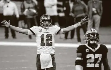  ?? Chris Graythen / Getty Images ?? Buccaneers quarterbac­k Tom Brady celebrates a first down against the Saints late in the fourth quarter as he avenged two losses against New Orleans this season by earning a spot in his 14th conference title game.