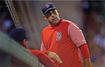  ?? MATT STONE / HERALD STAFF FILE ?? ‘TAINTED’: Red Sox manager Alex Cora was ousted amid an ongoing sign-stealing scandal. Greg Stevens, of Attleboro, below right, and Drew Caruso, below left, shared their views about the move on Wednesday.