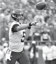  ?? AP Photo/Ed Zurga, File ?? ■ Jacksonvil­le Jaguars quarterbac­k Blake Bortles (5) throws a pass during the first half of an NFL football game against the Kansas City Chiefs on Oct. 7 in Kansas City, Mo. Bortles has a chance to become the fifth NFL quarterbac­k to throw for at least 375 yards in three straight games, but the Jacksonvil­le Jaguars would like to get back to running the ball despite several injuries that are making it more difficult.