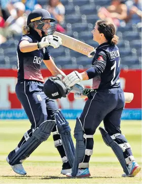  ??  ?? High there: Sarah Taylor (left) congratula­tes Tammy Beaumont on her century