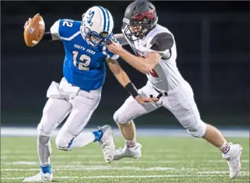  ?? Steph Chambers/ Post- Gazette ?? Elizabeth Forward's Jared Prah chases down Harper Conroy in a 35- 0 shutout of South Park Friday night. Elizabeth Forward is giving up the fewest points per game in the WPIAL ( 2.0).