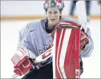  ?? CP PHOTO ?? Team Canada goaltender Charline Labonte takes a break during the team’s practice at the women’s world hockey championsh­ips Saturday in Kamloops, B.C.