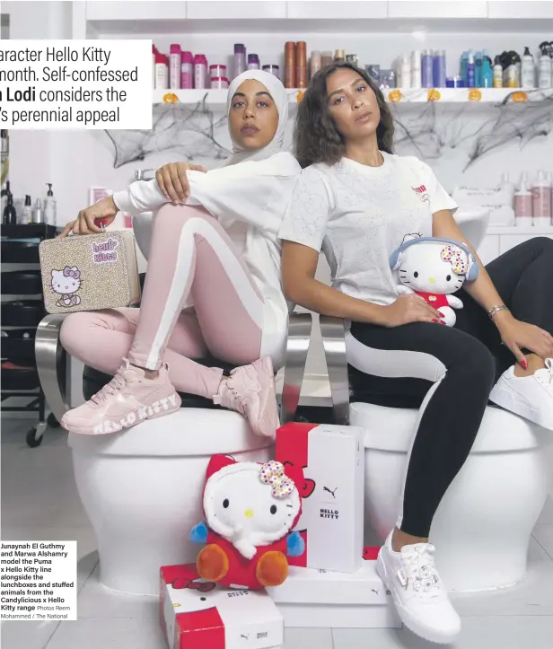  ?? Photos Reem Mohammed / The National ?? Junaynah El Guthmy and Marwa Alshamry model the Puma x Hello Kitty line alongside the lunchboxes and stuffed animals from the Candylicio­us x Hello Kitty range