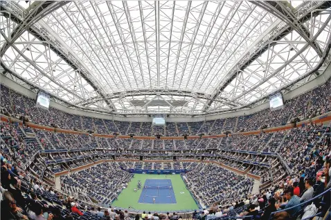  ?? ASSOCIATED PRESS FILE PHOTOS ?? Fans fill the stands in 2017 at Arthur Ashe stadium as Karolina Pliskova plays CoCo Vandeweghe during the quarterfin­als of the U.S. Open in New York. Gov. Andrew Cuomo announced Tuesday that the tournament will be played in Queens from Aug. 31 to Sept. 13, but without fans in attendance.