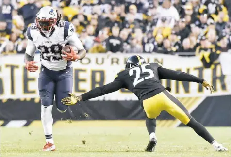  ?? Matt Freed/Post-Gazette ?? Artie Burns misses a tackle on New England’s LeGarrette Blount Sunday. Blount gouged the Steelers for 127 yards.