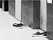  ?? DIRK SHADD/TAMPA BAY TIMES 2016 ?? There are 43,000 minors in U.S. detention facilities. Above, shoes of offenders outside confinemen­t rooms in Florida.