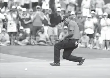  ?? Lynne Sladky/Associated Press ?? ■ Tiger Woods reacts to a missed putt on the 11 green during the final round of The Players Championsh­ip golf tournament Sunday in Ponte Vedra Beach, Fla.