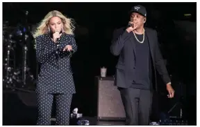  ?? (AP file photo) ?? Beyonce, shown performing with her husband, Jay-Z, at a 2016 rally for Democratic presidenti­al candidate Hillary Clinton in Cleveland, has received 79 Grammy nomination­s in her career. She’s the second-most-nominated act in the history of the awards show, trailing only Jay-Z and Quincy Jones, who each have 80.