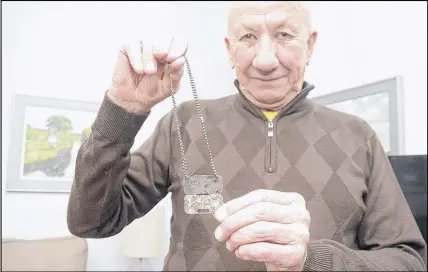  ?? HARRY SULLIVAN/ TRURO NEWS ?? Frank Leblanc, a member of the Air Force Club in Truro, is hoping to hear from someone who can identify the person who owned military dog tags discovered in a Masstown garden.