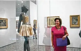  ?? James Nielsen / Houston Chronicle ?? Karen Dixon of BBVA Compass views “The Little Fourteen-Year-Old Dancer” at the Museum of Fine Arts, Houston. The bank is sponsoring the Degas exhibit.