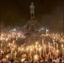  ?? NEW YORK TIMES 2017 ?? Charlottes­ville, Virginia: Torch-bearing white nationalis­ts rally around a statue of Thomas Jefferson near the University of Virginia in 2017. There is a push for Congress to enact a federal domestic terrorism law.