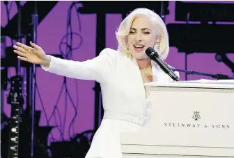  ?? — THE ASSOCIATED PRESS FILES ?? Pop music icon Lady Gaga shared a toast with Canadian choir conductor Noel Edison at the 2010 Grammy Awards in Los Angeles.