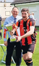  ?? ?? Trophy Skipper Niall Mcclure with the trophy