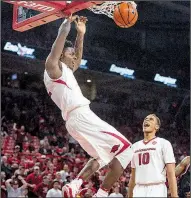  ?? NWA Democrat-Gazette/BEN GOFF ?? Adrio Bailey (left), Daniel Gafford and the Arkansas’ men’s basketball team are off to a 5-1 start, giving reasons for Razorbacks fans to be excited following a dismal football season.