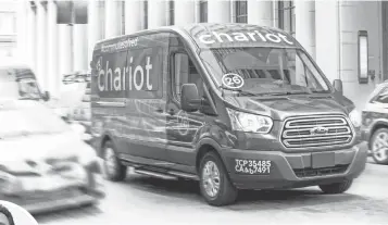  ?? TOMMY LAU ?? Ford acquired the ride- sharing van service Chariot in September.