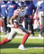  ?? Terrance Williams / Associated Press ?? Giants tight end Evan Engram runs the ball during Sunday’s game against the Ravens.