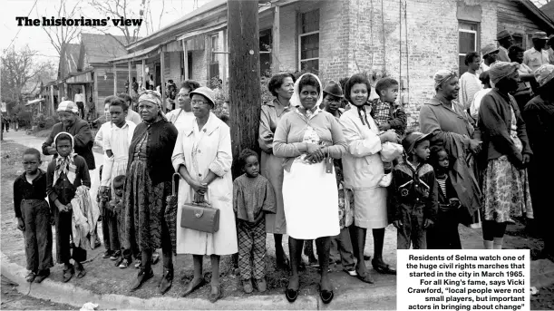  ??  ?? Residents of Selma watch one of the huge civil rights marches that started in the city in March 1965. For all King’s fame, says Vicki Crawford, “local people were not small players, but important actors in bringing about change”