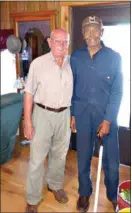  ?? (Contribute­d) ?? Left, Arthur Winright and his produce-selling partner Mr. White stand together. Centter and right, Arthur Winright plants and harvests crops on his farm in Strong in 2011.