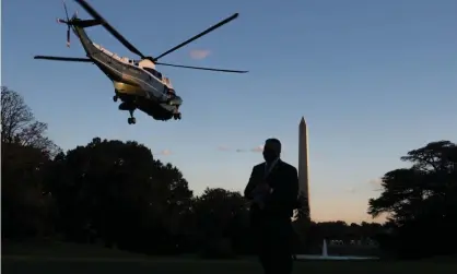  ?? Photograph: Saul Loeb/AFP/Getty Images ?? Marine One takes President Trump from the White House to the Walter Reed Military Medical Center.