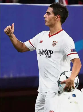  ??  ?? Rightful owner: Wissam Ben Yedder showing the thumbs-up sign to Sevilla fans after scoring a hattrick against Maribor in Seville on Tuesday. — Reuters