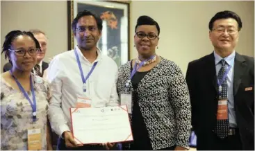  ??  ?? TOP HONOUR: Cape Times columnist Shanil Haricharan flanked by chief director Dr Fikile Ndlovu (left) and director Senzeni Mkhize both from the KZN Office of the Premier and Professor Zhu Xiaoning, chairperso­n of the Internatio­nal Conference on Public...