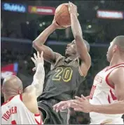  ?? Luis Sinco Los Angeles Times ?? LAKERS GUARD ANDRE INGRAM shoots between Rockets defenders during Tuesday’s game.