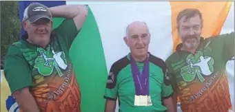  ??  ?? John Keenan (centre, with his three medals) with teammates Malcolm O’Callaghan and James Galvin in Switzerlan­d.