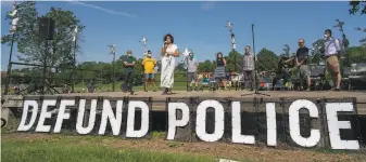  ?? Jerry Holt / (Minneapoli­s) Star Tribune ?? Minneapoli­s Councilwom­an Alondra Cano speaks at rally calling for defunding the Police Department. A commission is weighing a charter amendment that would restructur­e the force.