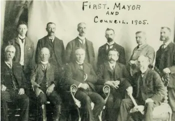  ?? CITY OF EDMONTON ARCHIVES/SUPPLIED ?? Ald. Kenneth McLeod, back row, third from right, and Ald. Charles May, front row, second from left, came close to blows in a discussion about adding electrical power for daytime use.