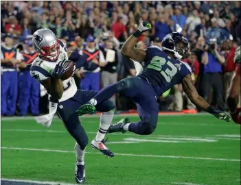  ?? AP Photo/Kathy Willens ?? New England Patriots strong safety Malcolm Butler (21) intercepts a pass intended for Seattle Seahawks wide receiver Ricardo Lockette (83) during the second half of NFL Super Bowl XLIX football game in 2015, in Glendale, Ariz.