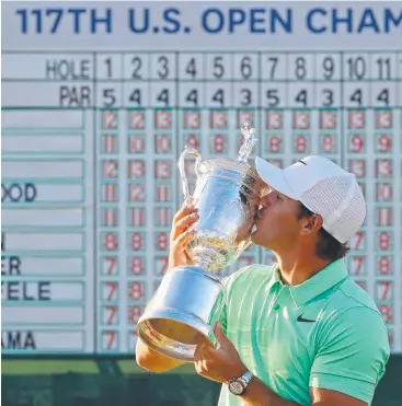  ?? Picture: GETTY ?? SWEET SUCCESS: Brooks Koepka kisses the winner's trophy after his victory at the 2017 US Open at Erin Hills.