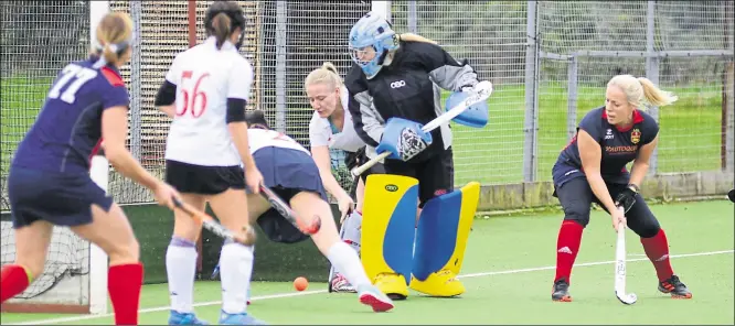  ?? Picture: Paul Amos FM21781752 ?? Ashford ladies’ 2nds (dark blue) attack the Gravesend goal during Saturday’s 2-2 draw in Kent Division 1. More hockey, page 41