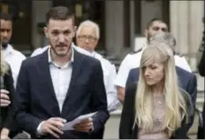  ?? MATT DUNHAM - THE ASSOCIATED PRESS ?? In this file photo dated July 24, Chris Gard, the father of critically ill baby Charlie Gard reads a statement next to mother Connie Yates, right, at the end of their case at the High Court in London. British media are reporting a family announceme­nt...