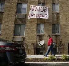  ??  ?? NEED A BREAK: Signs that read ‘No Job No Rent’ hang from the windows of an apartment building during the coronaviru­s pandemic in Northwest Washington, D.C.