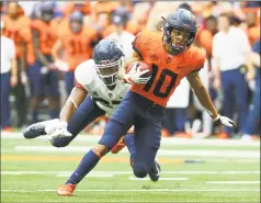  ?? Rich Barnes / Getty Images ?? Syracuse’s Sean Riley runs with the ball after a catch in front of UConn’s Omar Fortt on Saturday.