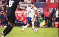  ?? Brett Carlsen / Getty Images ?? Christian Pulisic of United States runs with the ball against Canada during the first half of a World Cup qualifying match on Sunday in Nashville, Tenn.