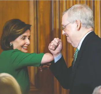  ?? SUSAN WALSH / THE ASSOCIATED PRESS ?? House Speaker Nancy Pelosi and Senate Majority Leader Mitch Mcconnell bump elbows rather than
shake hands at a lunch with Irish Prime Minister Leo Varadkar on Capitol Hill earlier this week.