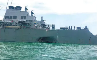  ??  ?? Ten sailors are missing and five were injured after a US warship collided with an oil tanker east of Singapore on Monday, the US Navy said, the second accident involving US Navy destroyers in Asian waters in little more than two months. (Reuters)