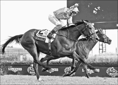  ?? EMILY SHIELDS ?? Enable on Saturday gives jockey Frankie Dettori his fifth win in the Breeders’ Cup Turf.