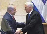  ?? ARIEL SCHALIT/ POOL VIA NEW YORK TIMES ?? Vice President Mike Pence, right, shakes hands with Israeli Prime Minister Benjamin Netanyahu in Jerusalem earlier this year.