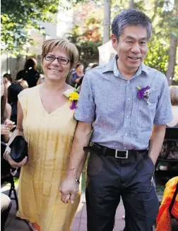  ??  ?? Heidi Friesen-Kobayashi and her husband, Norm Kobayashi, at the 2012 wedding of their daughter, Misa.
