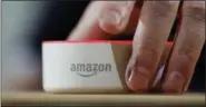  ??  ?? An Amazon Echo Dot is displayed during a program announcing several new Amazon products by the company, in Seattle. There sure are a lot of these devices, aren’t there?