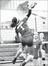  ?? Photo by Mike Eckels ?? Decatur’s Desi Meek goes for a spike during the high school volleyball match against West Fork on Oct. 5.