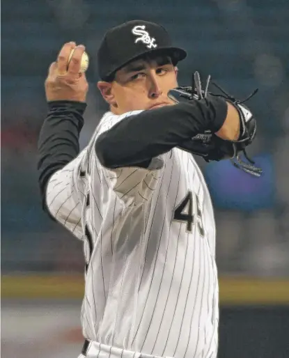  ?? | DAVID BANKS/ GETTY IMAGES ?? Derek Holland allowed three runs ( two earned) and four hits in six- plus innings Friday against the Twins.