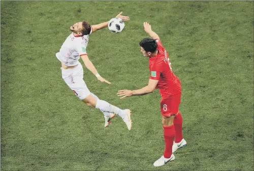  ?? PICTURE: TIM GOODE/PA WIRE ?? ARCHED ENEMY: Tunisia’s Fakhreddin­e Ben Youssef assumes a dramatic pose in a challenge with England’s Harry Maguire in Monday night’s game.