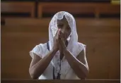  ?? INTI OCON — THE ASSOCIATED PRESS ?? A Catholic woman attends Sunday's mass at the Metropolit­an Cathedral in Managua, Nicaragua, on Sunday.